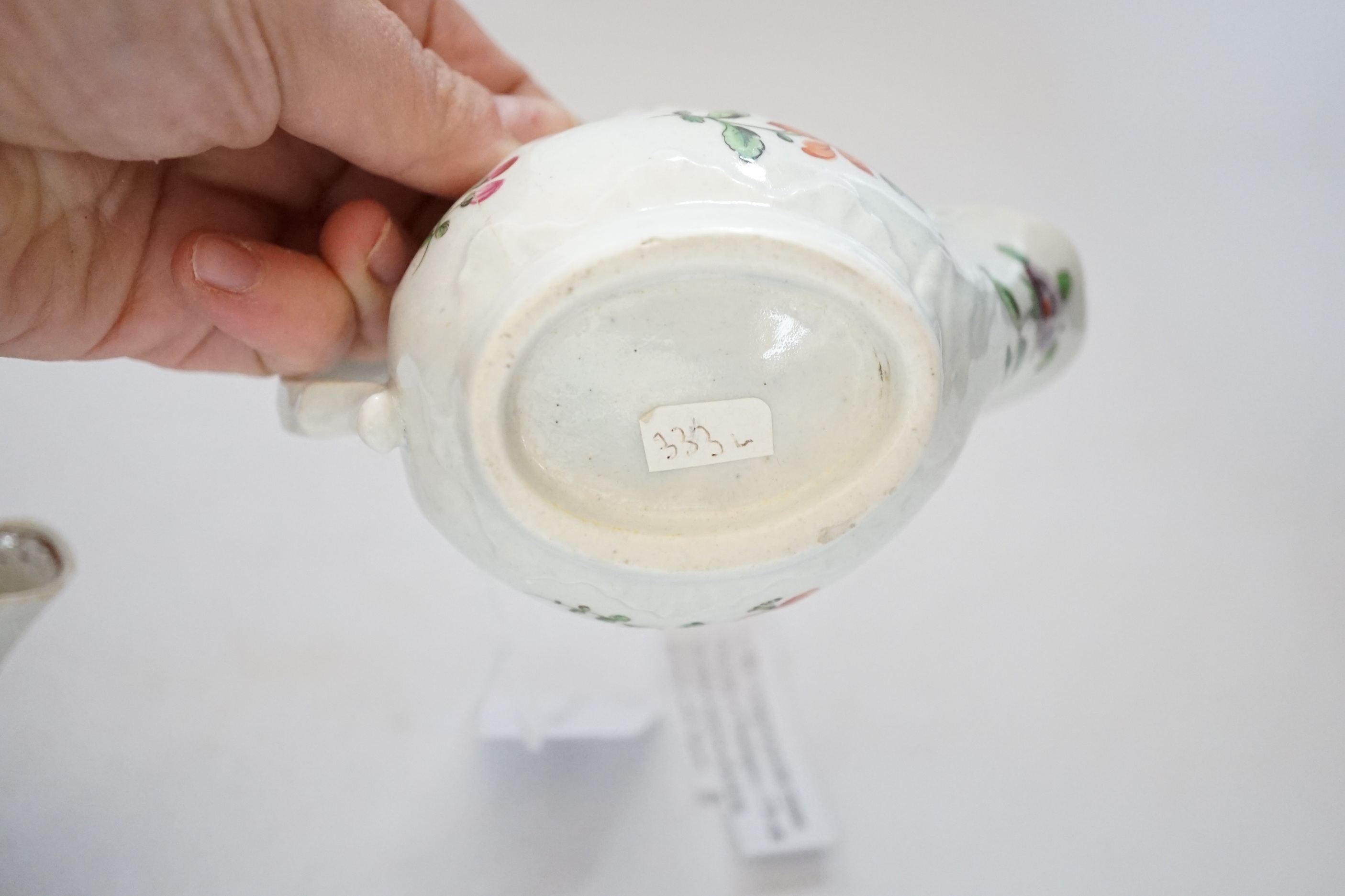 A Chaffers Liverpool saucer, c.1760 and two 18th century Christian or Pennington sauceboats, saucer 12cm diameter